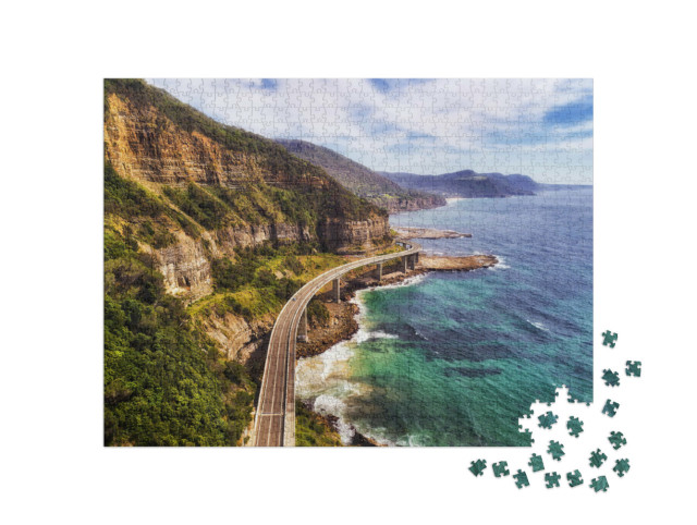 Puzzle 1000 Teile „Seeklippenbrücke auf dem Grand Pacific Drive, Australien“