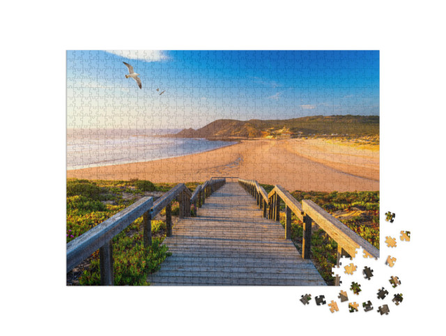 Puzzle 1000 Teile „Holzsteg zum Strand Praia da Amoreira, Algarve, Portugal“