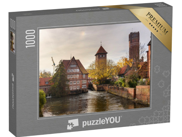Puzzle 1000 Teile „Ratsmühle oder alte Wassermühle und Wasserturm an der Ilmenau, Lüneburg“