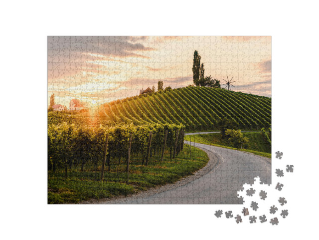 Puzzle 1000 Teile „Asphaltstraße durch südösterreichische Weinberge in der Südsteiermark“