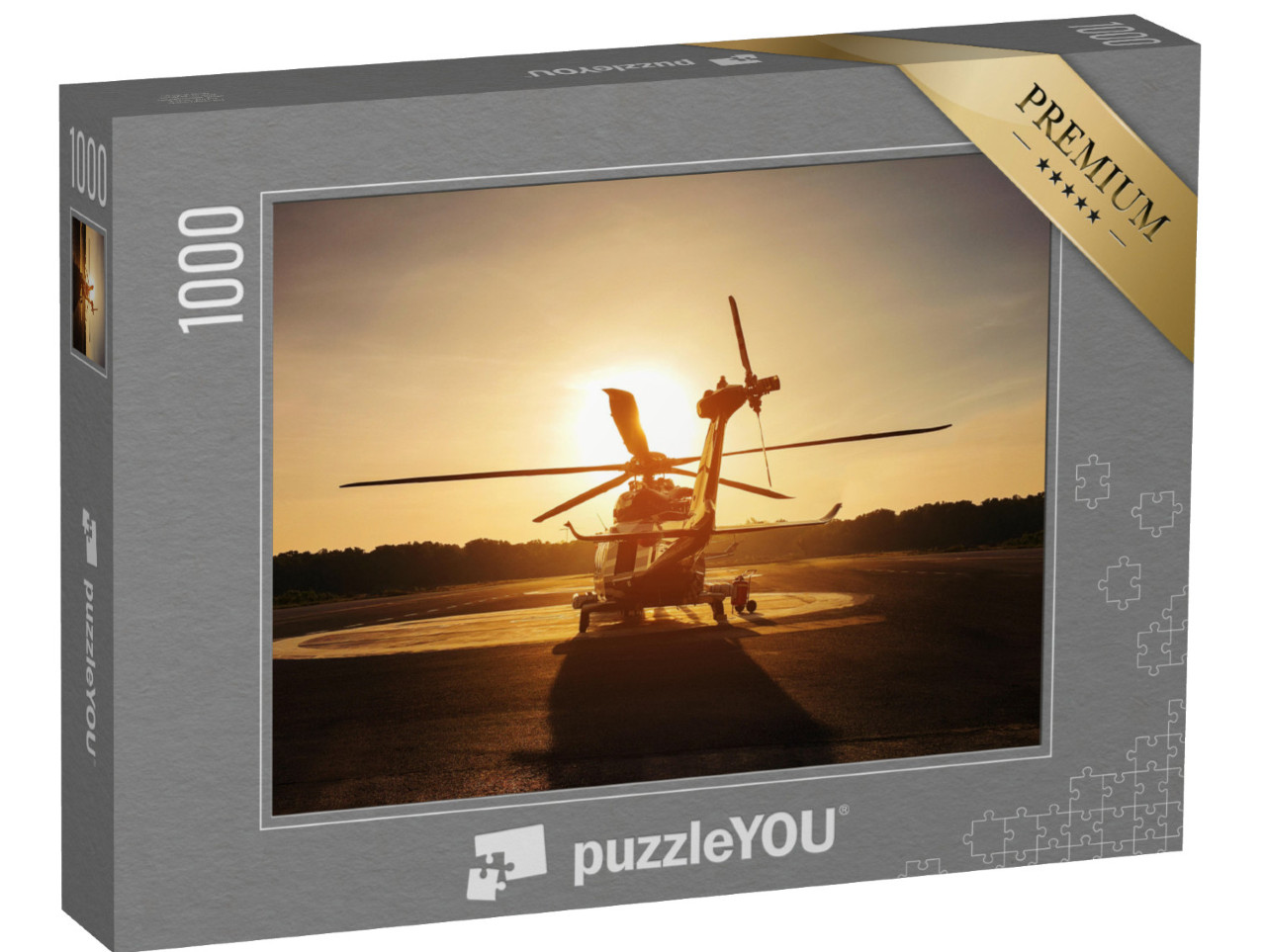 Puzzle 1000 Teile „Hubschrauber auf dem Landeplatz im Sonnenuntergang“