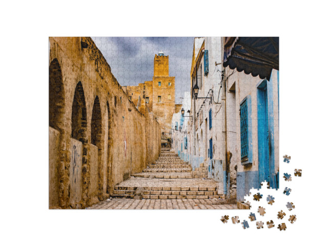 Puzzle 1000 Teile „Straße durch Medina, Tunesien“