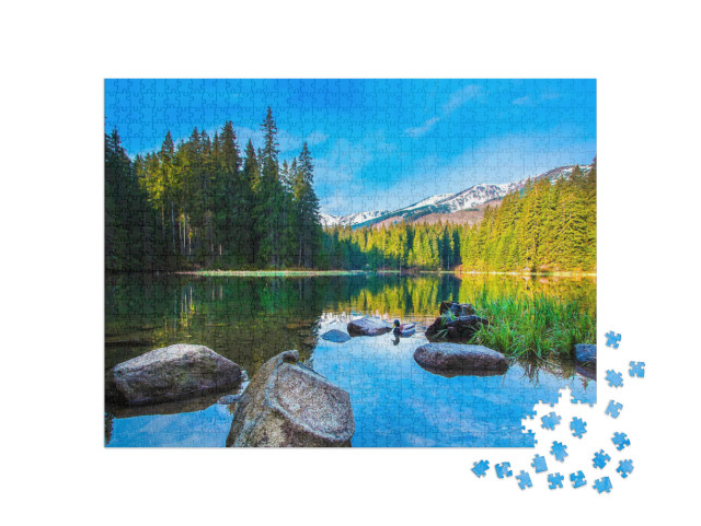 Puzzle 1000 Teile „Steine im ruhigen Wasser eines Bergsees“