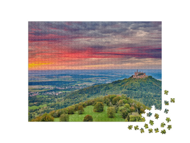 Puzzle 1000 Teile „Burg Hohenzollern: Berggipfel bei Sonnenuntergang“