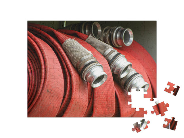 Puzzle 100 Teile „Aufgerollter Feuerwehrschlauch“