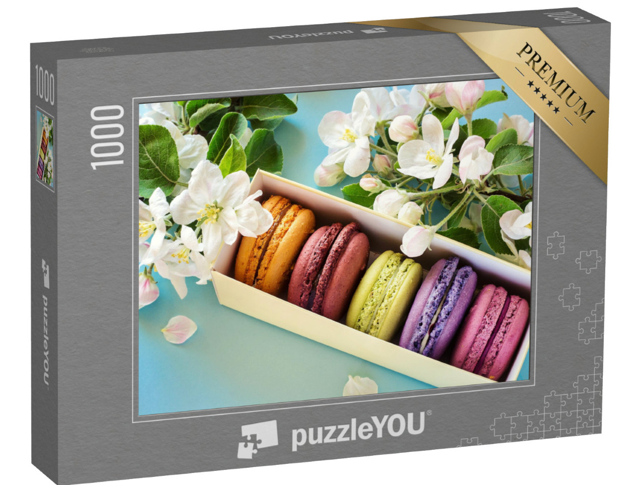 Puzzle 1000 Teile „Schachtel mit bunten Makarons, umrahmt von Apfelblüten“
