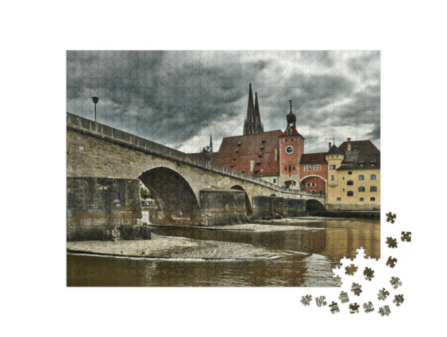 Puzzle 1000 Teile „Regensburg mit Steinbrücke und Dom St. Peter“