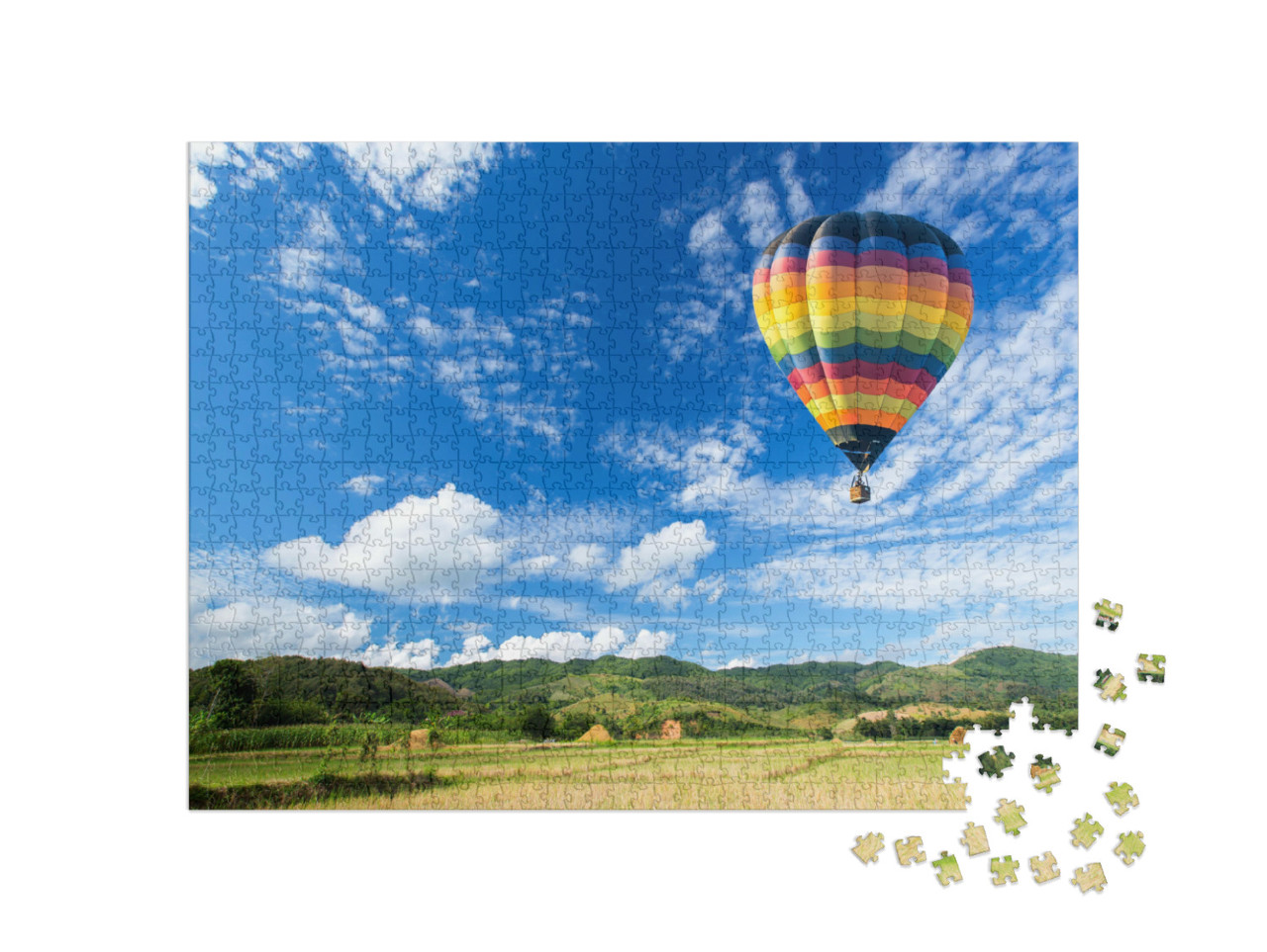 Puzzle 1000 Teile „Heißluftballon über dem Feld mit blauem Himmel“