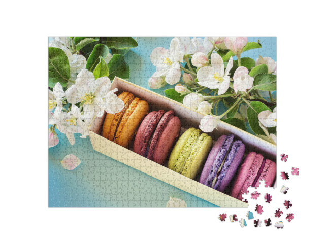 Puzzle 1000 Teile „Schachtel mit bunten Makarons, umrahmt von Apfelblüten“