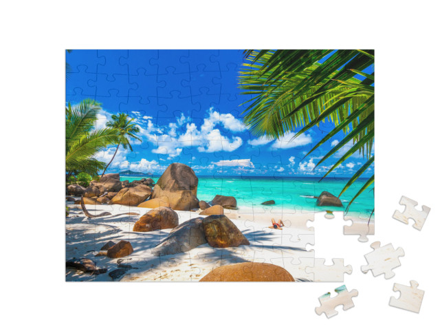 Puzzle 100 Teile „Strand auf den Seychellen mit Granitfelsen“