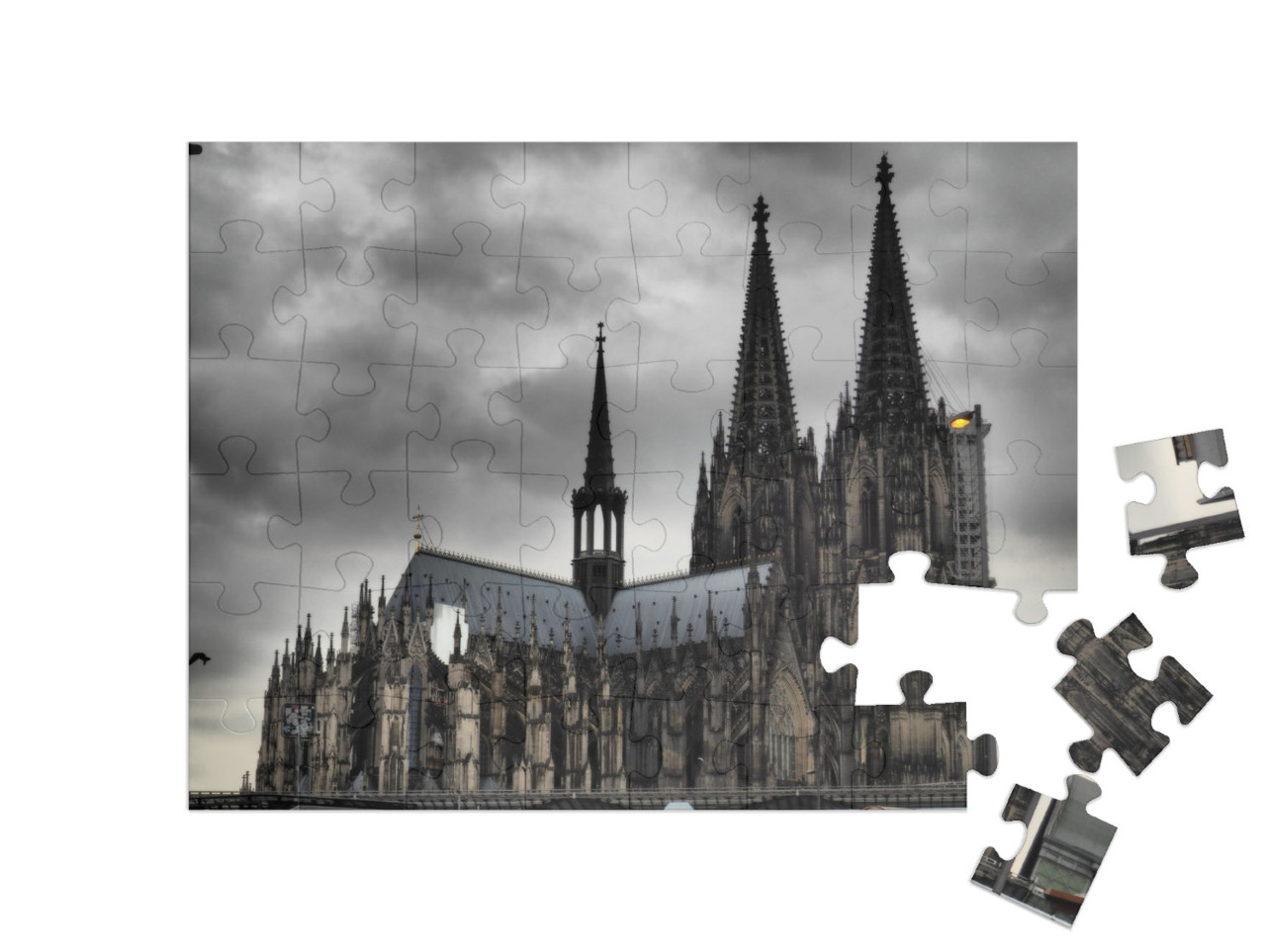 Puzzle 48 Teile „Kölner Dom unter dunkeln Wolken“