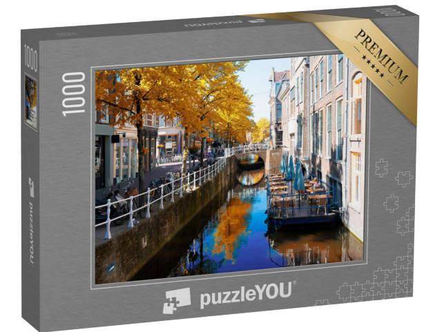 Puzzle 1000 Teile „Herbstliche Straße mit Kanal in der Altstadt von Delft, Niederlande“