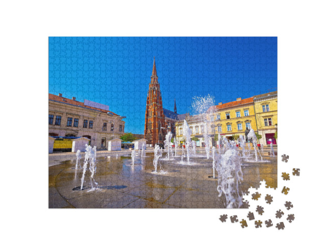 Puzzle 1000 Teile „Osijek: Hauptplatz mit Brunnen und Kathedrale, Kroatien“