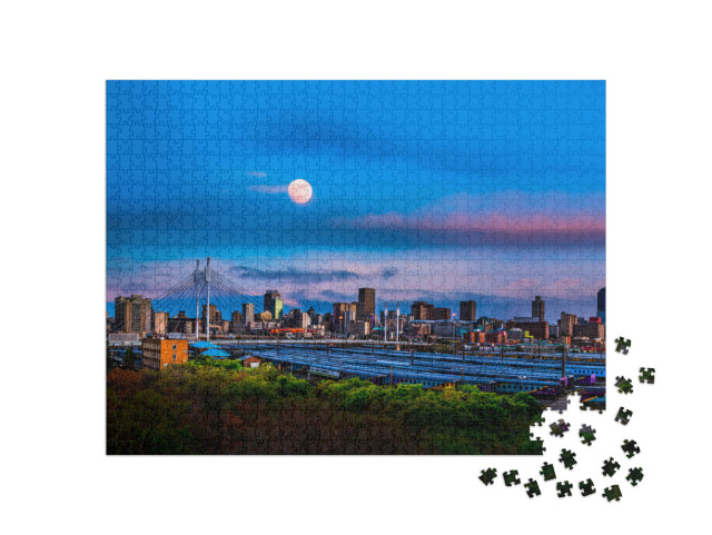 Puzzle 1000 Teile „Skyline von Johannesburg mit der Nelson Mandela Brücke“
