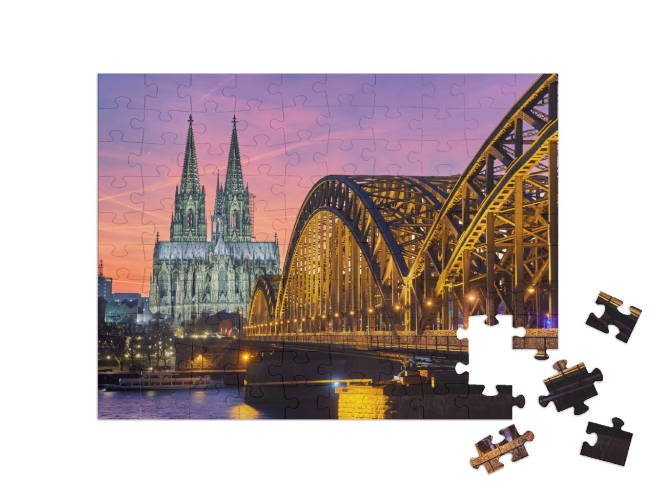 Puzzle 100 Teile „Kölner Dom und Hohenzollernbrücke bei Sonnenuntergang“