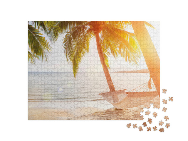 Puzzle 1000 Teile „Hängematte an einer Palme bei Sonnenuntergang“