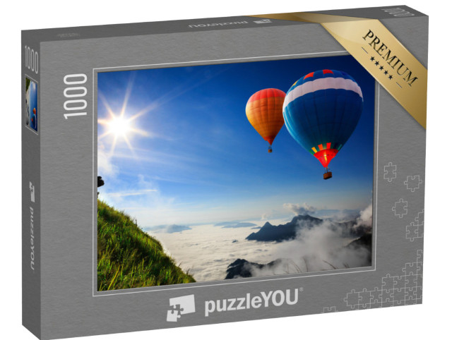 Puzzle 1000 Teile „Bunte Heißluftballons über Berggipfeln im Nebel“