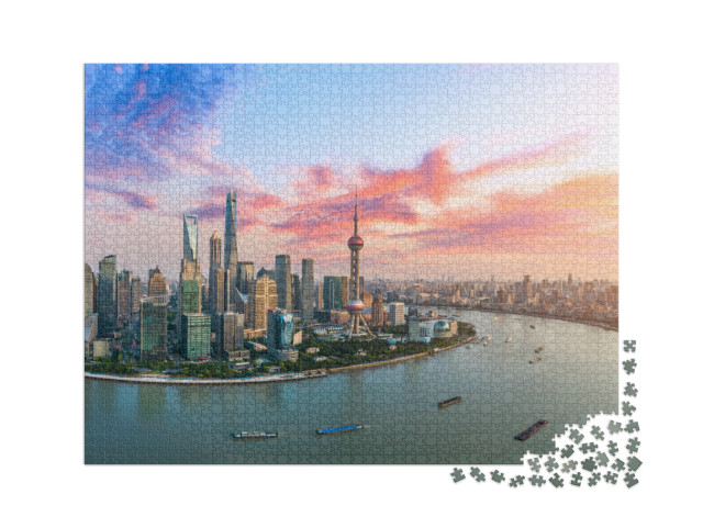 Puzzle 2000 Teile „Luftaufnahme der Skyline von Shanghai im Abendlicht“