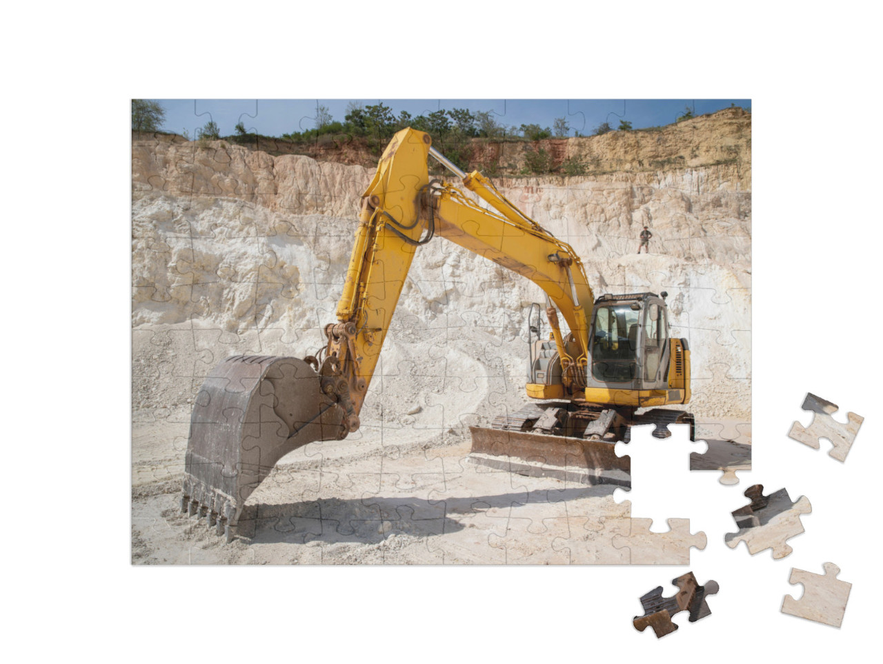 Puzzle 100 Teile „Hydraulischer Raupenbagger bei der Arbeit im Steinbruch“