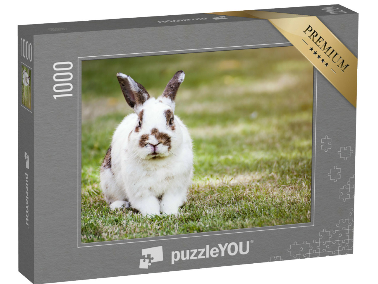 Puzzle 1000 Teile „Süßes geflecktes Kaninchen auf grünem Gras“
