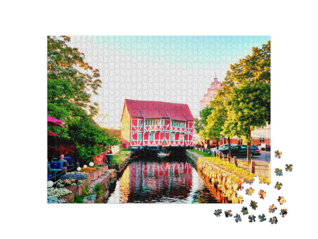Puzzle 1000 Teile „Rotes Fachwerkhaus in Wismar am Kanal, Deutschland“