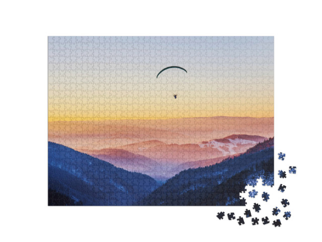 Puzzle 1000 Teile „Mit dem Gleitschirm in den Sonnuntergang “