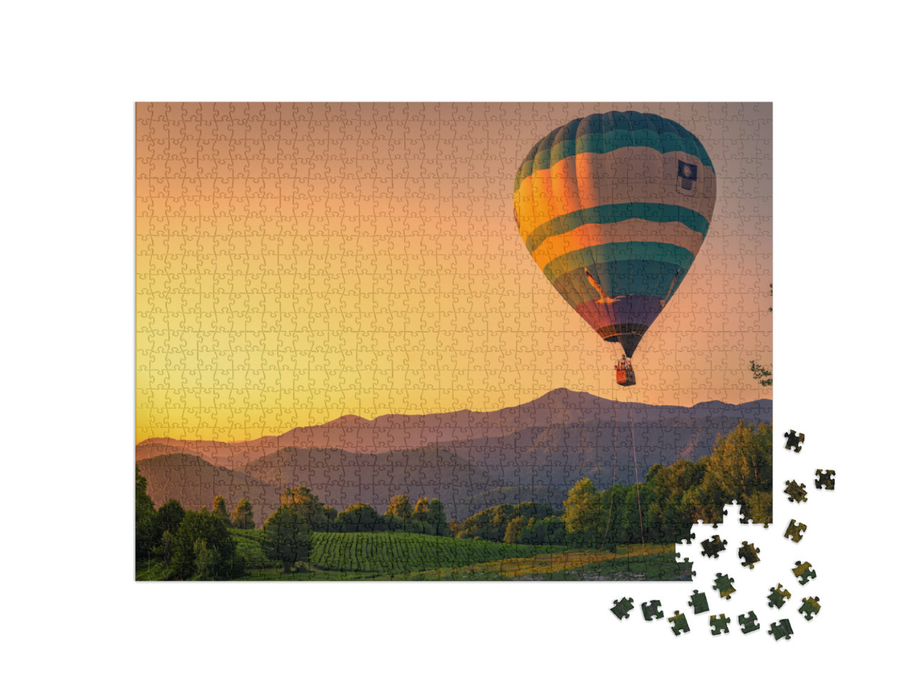 Puzzle 1000 Teile „Heißluftballon in wunderschöner Landschaft bei Sonnenuntergang“