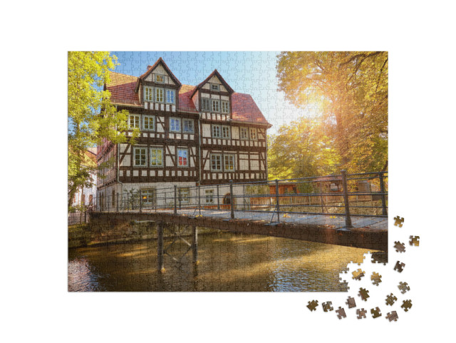 Puzzle 1000 Teile „Historisches Fachwerkhaus an der Gera, Erfurt“