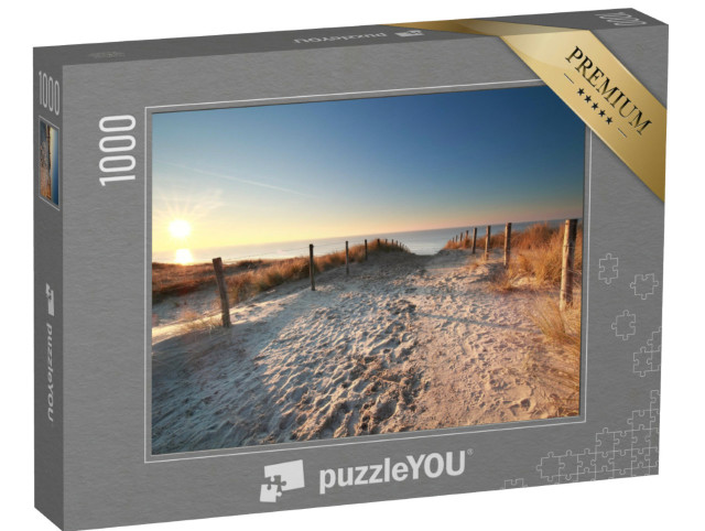 Puzzle 1000 Teile „Sonnenlicht über einem Sandweg zum Nordseestrand, Holland“