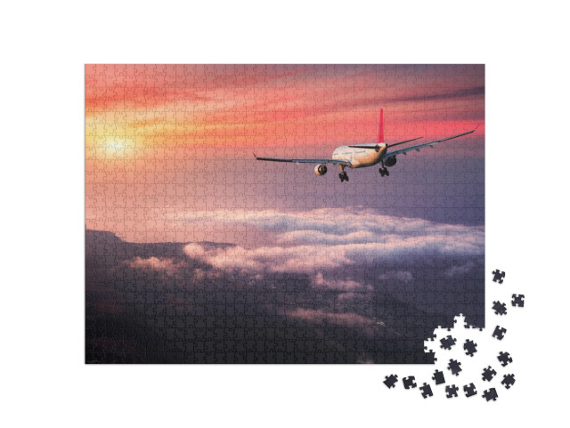 Puzzle 1000 Teile „Flugzeug im roten Abendhimmel über den Wolken“