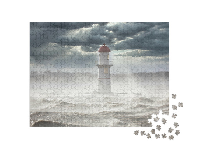 Puzzle 1000 Teile „Leuchtturm unter dunklen Wolken “