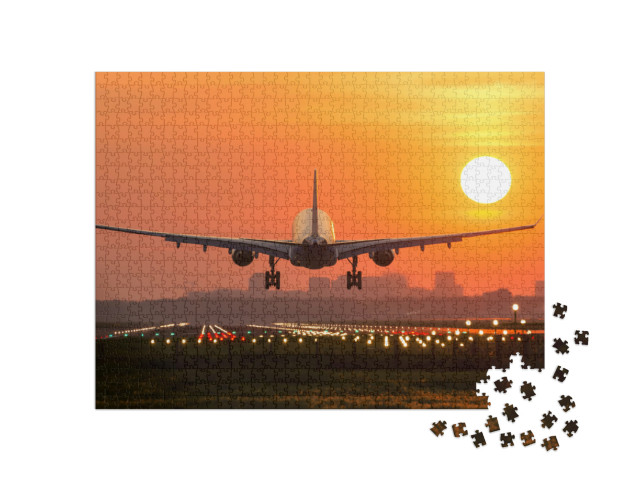 Puzzle 1000 Teile „Passagierflugzeug bei der Landung im Sonnenuntergang“