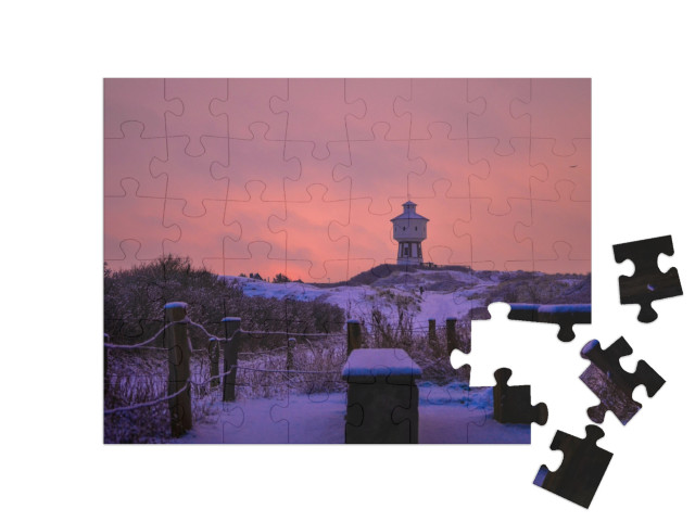 Puzzle 48 Teile „Langeoog: Winterbild mit dem Turm“
