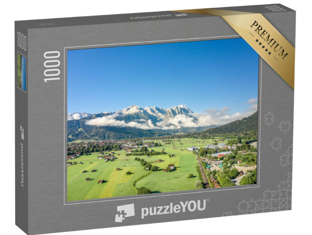 Puzzle 1000 Teile „Garmisch-Partenkirchen mit Blick auf die Zugspitze im Nebel“