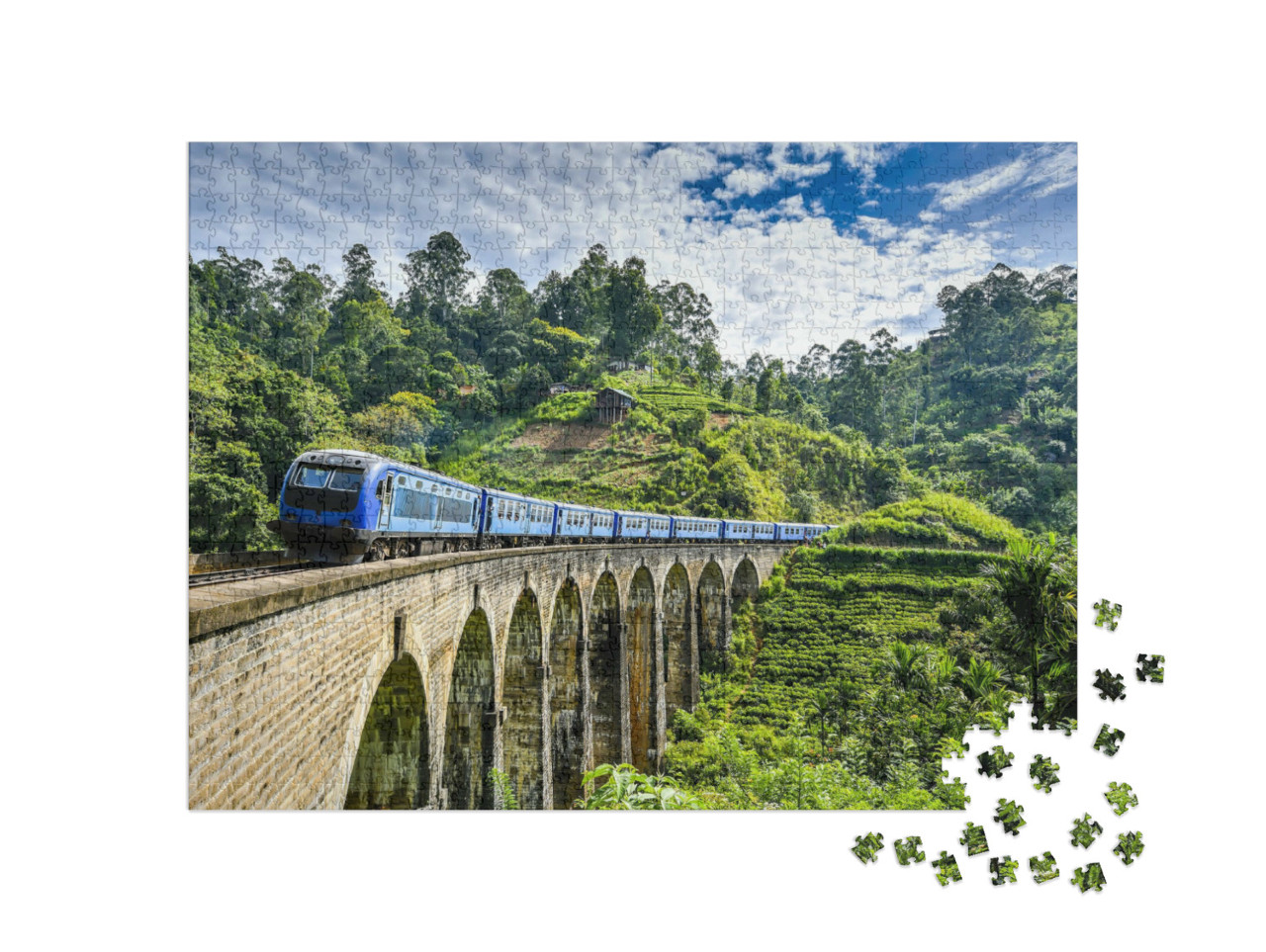 Puzzle 1000 Teile „Eisenbahnbrücke auf grüner Berglandschaft“