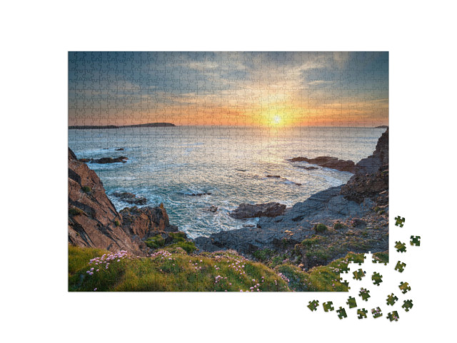 Puzzle 1000 Teile „Sonnenuntergang an der Longcarrow Cove bei Padstow in Cornwall“