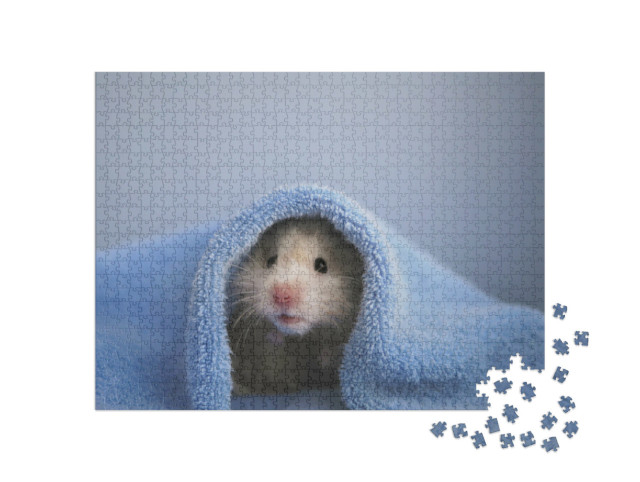Puzzle 1000 Teile „Ein Hamster in einem kuscheligen blauen Handtuch“