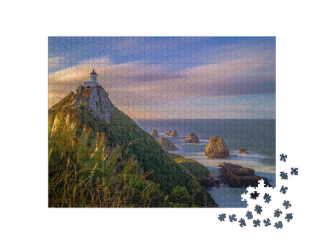 Puzzle 1000 Teile „Wolken über dem Leuchtturm am Nugget Point, Herbst in Neuseeland“
