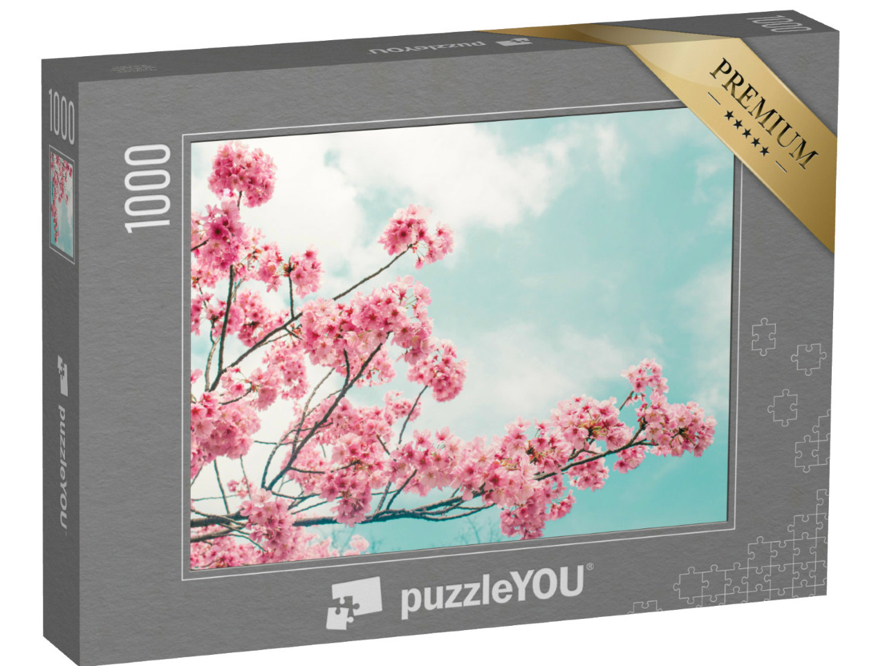 Puzzle 1000 Teile „Wunderschön blühender Kirschblütenzweig vor blauen Himmel“