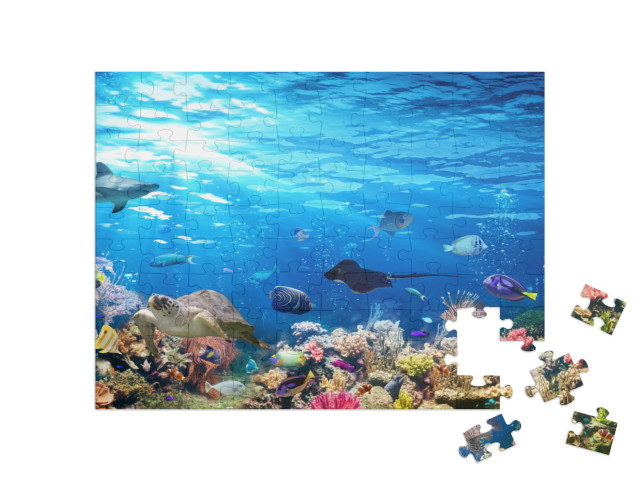 Puzzle 100 Teile „Unterwasser-Szene mit Korallenriff, Fischen, Haien, Schildkröte und Manta“